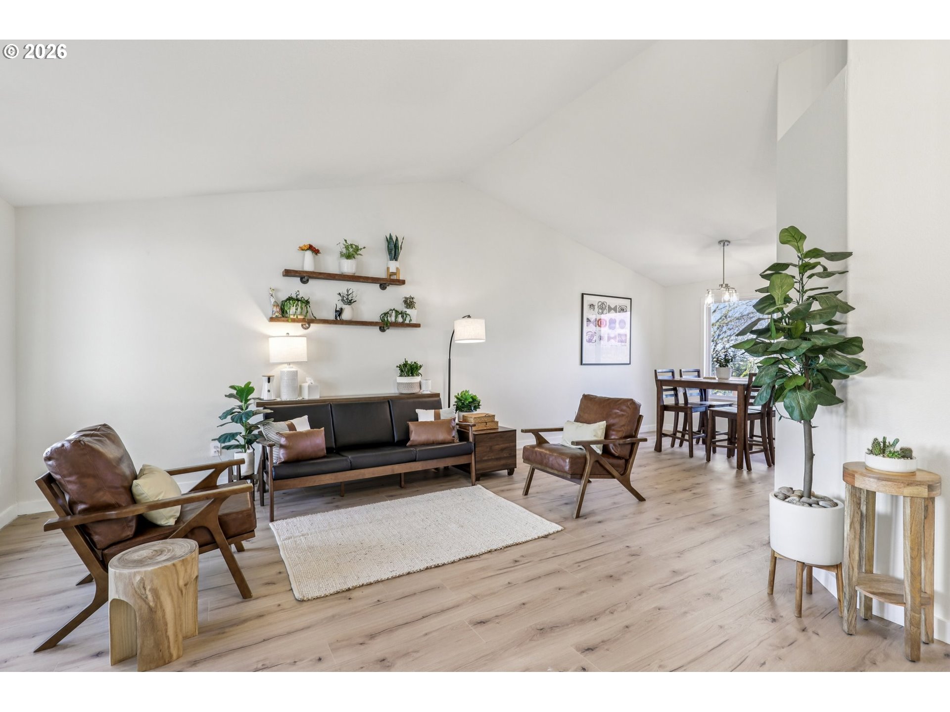 1702 Northeast 70th Street Vancouver, WA 98665 - Photo 6 of 32 a living room with furniture and a potted plant