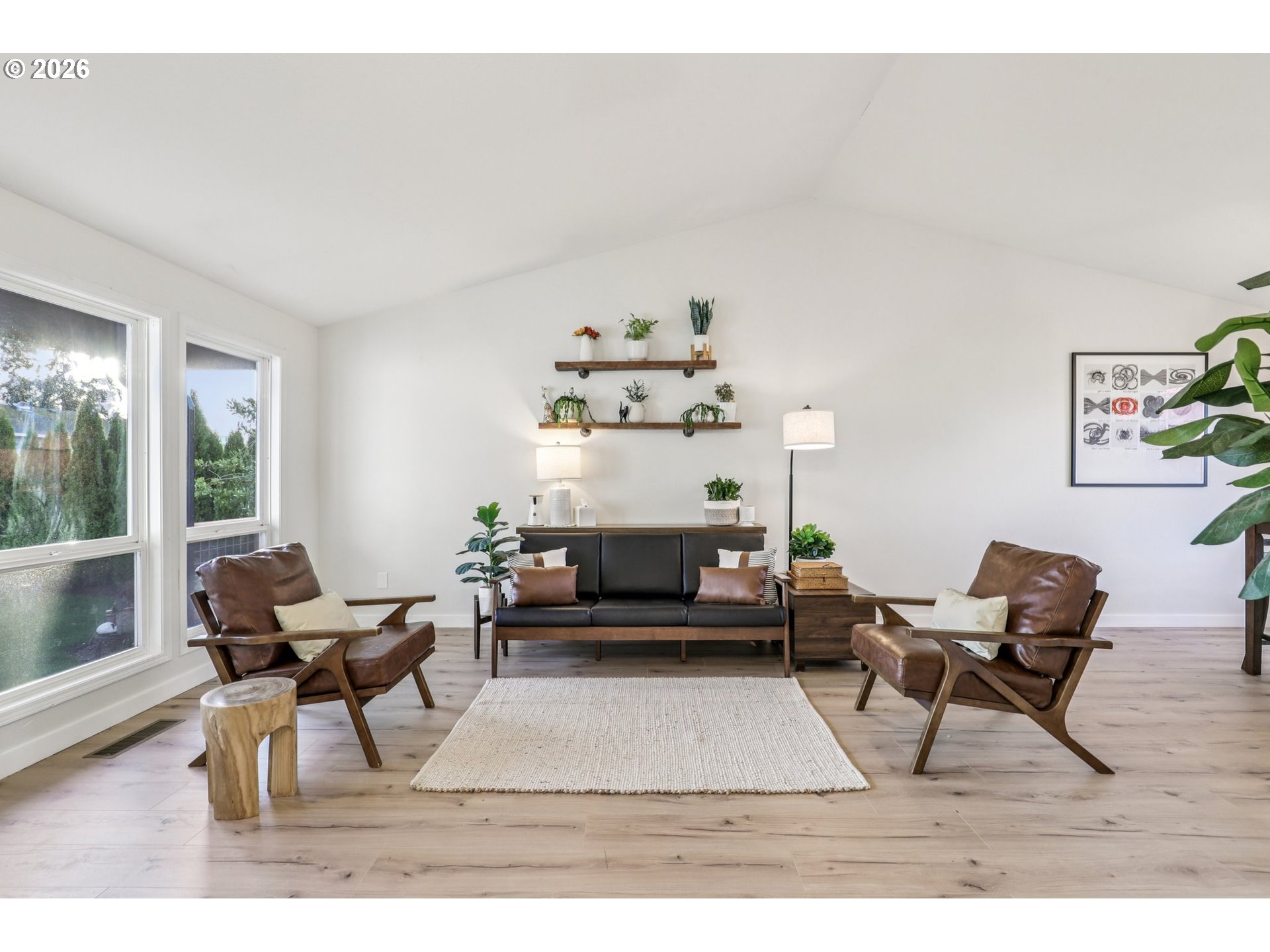 1702 Northeast 70th Street Vancouver, WA 98665 - Photo 7 of 32 a living room with furniture and a potted plant