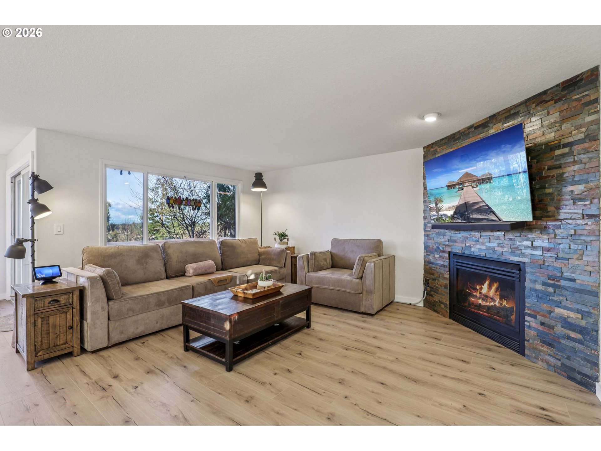 1702 Northeast 70th Street Vancouver, WA 98665 - Photo 10 of 32 a living room with furniture and a fireplace