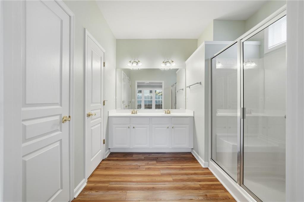 3901 Delfaire Trace Cumming, GA 30040 - Photo 31 of 45 a bathroom with a sink and a mirror