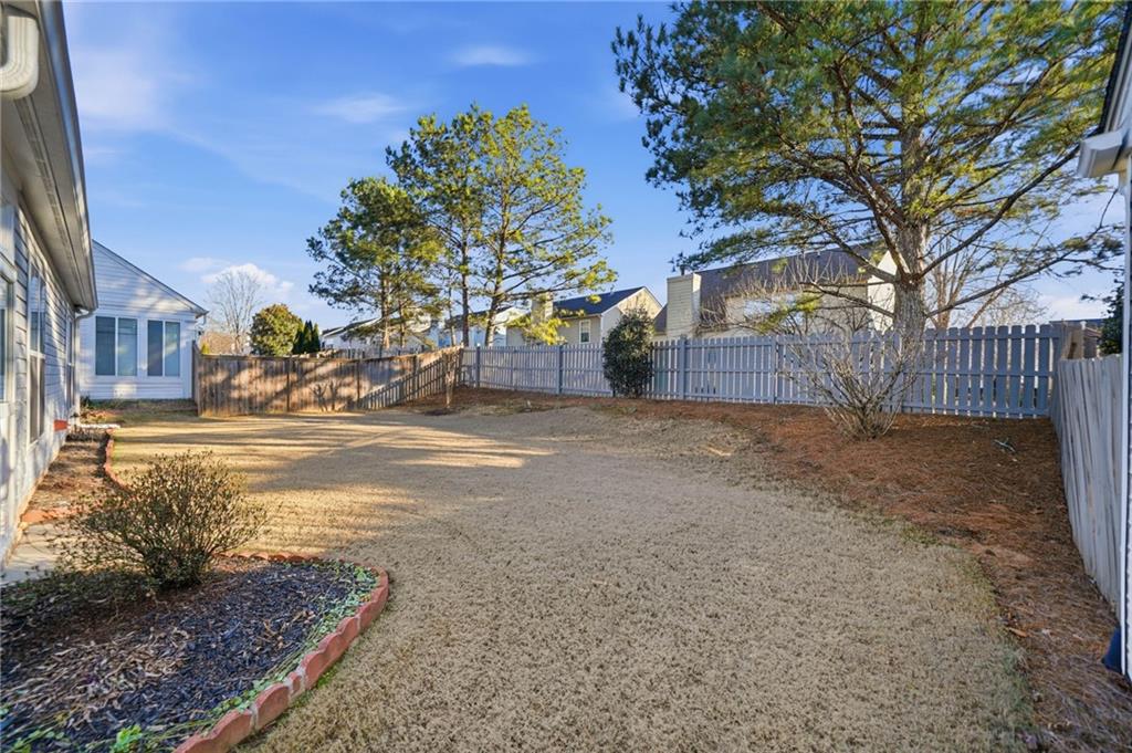 3901 Delfaire Trace Cumming, GA 30040 - Photo 10 of 45 a view of a yard with a house