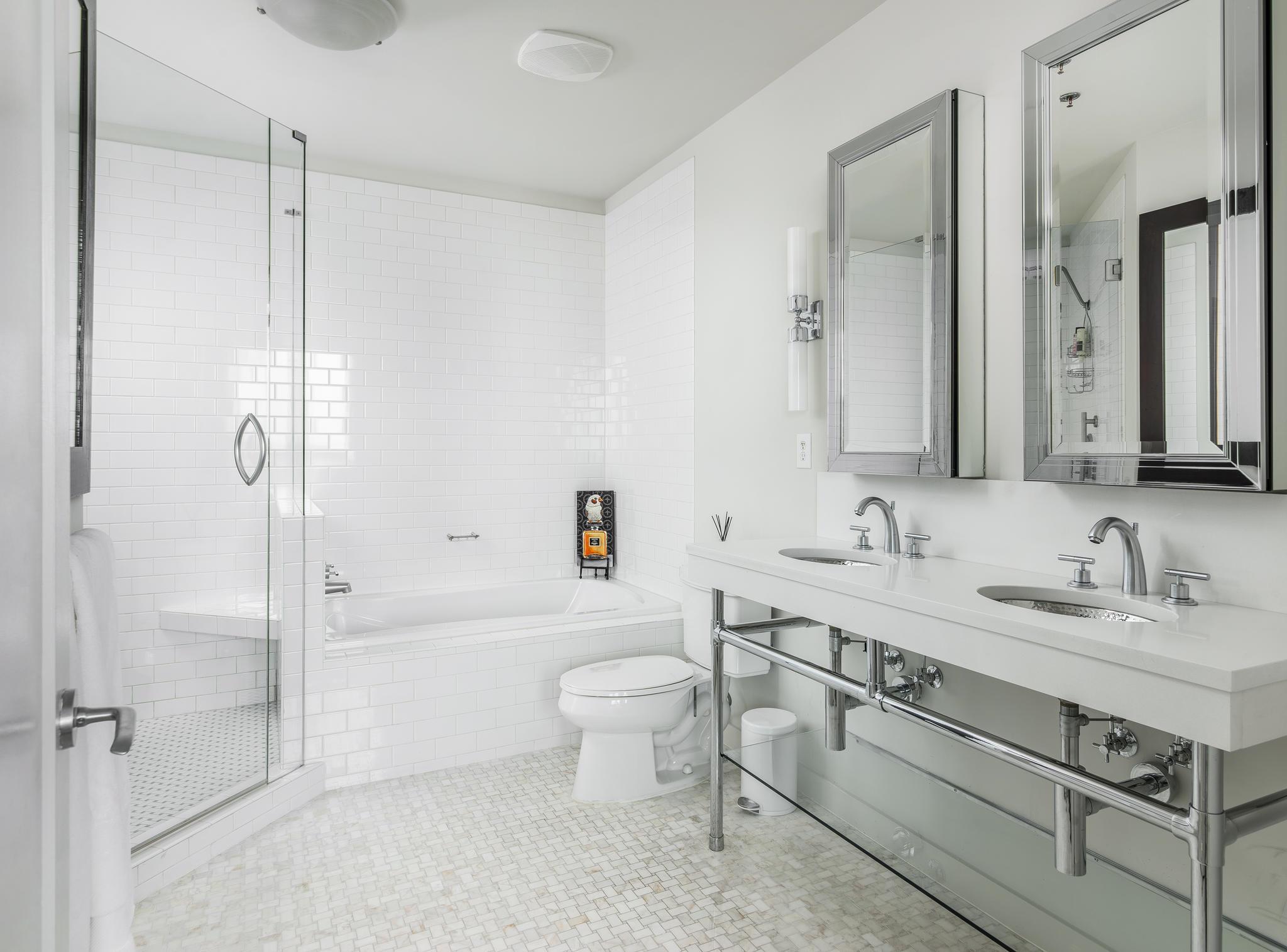 900 20th Avenue South, Unit 1001 Nashville, TN 37212 - Photo 12 of 30 a bathroom with a toilet sink and shower