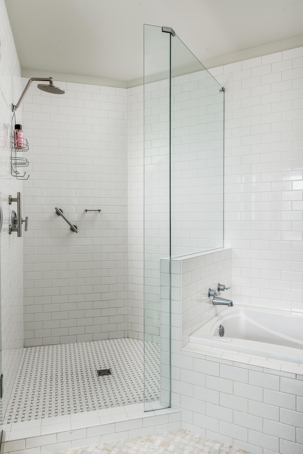 900 20th Avenue South, Unit 1001 Nashville, TN 37212 - Photo 13 of 30 a bathroom with a bathtub and a shower