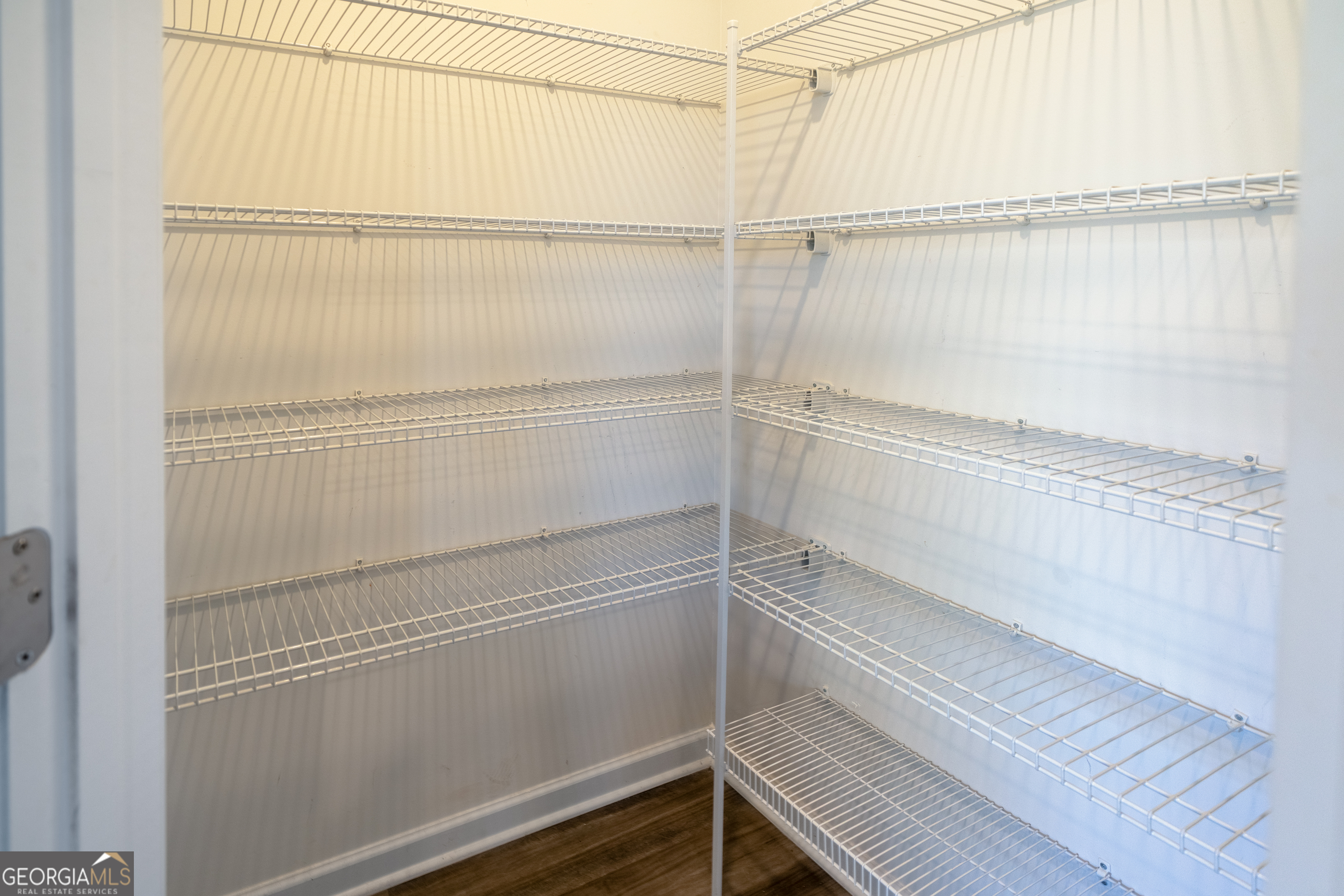 132 Fresh Laurel Lane Locust Grove, GA 30248 - Photo 11 of 24 a view of a room with racks on the wall