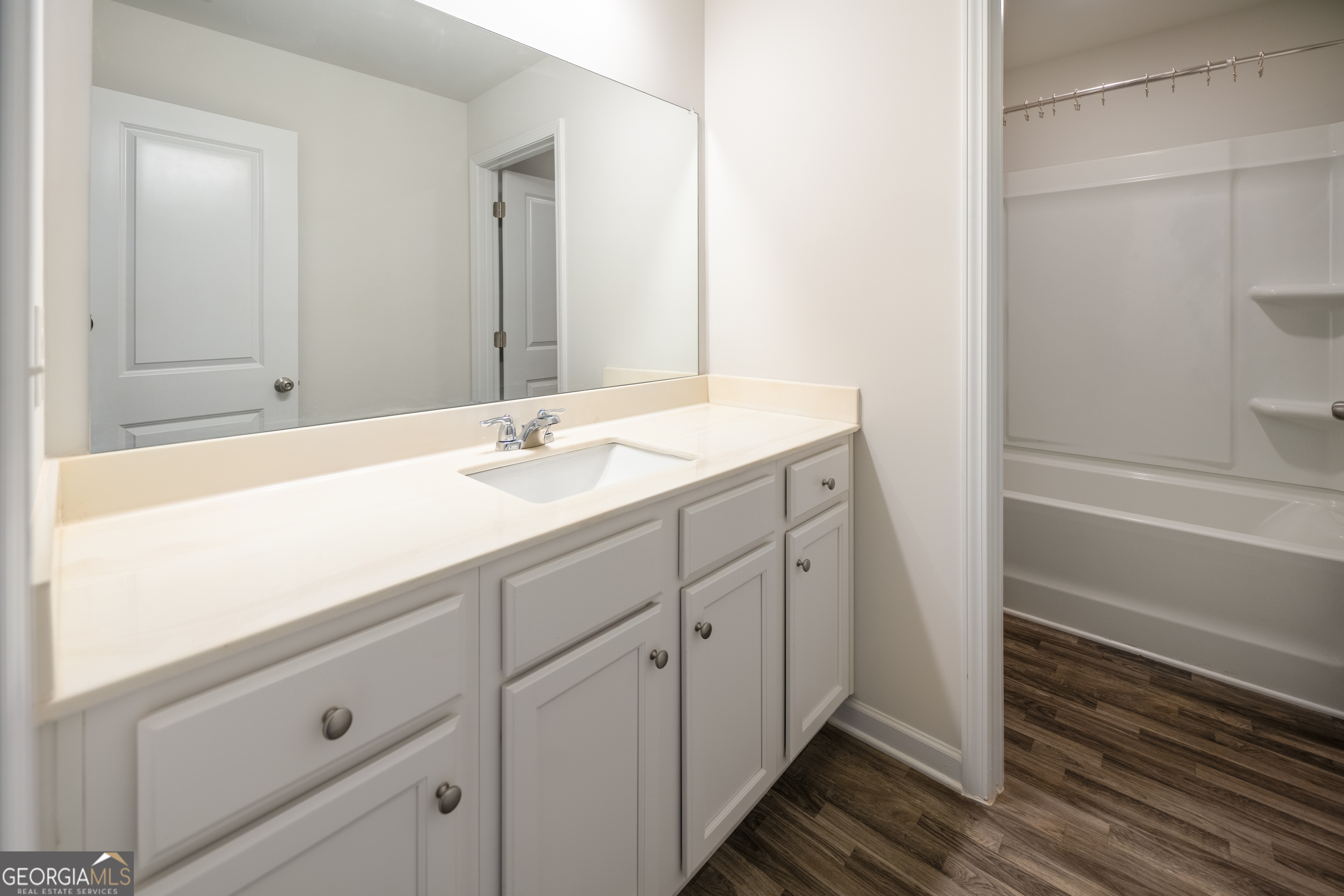 132 Fresh Laurel Lane Locust Grove, GA 30248 - Photo 19 of 24 a bathroom with a sink and a mirror
