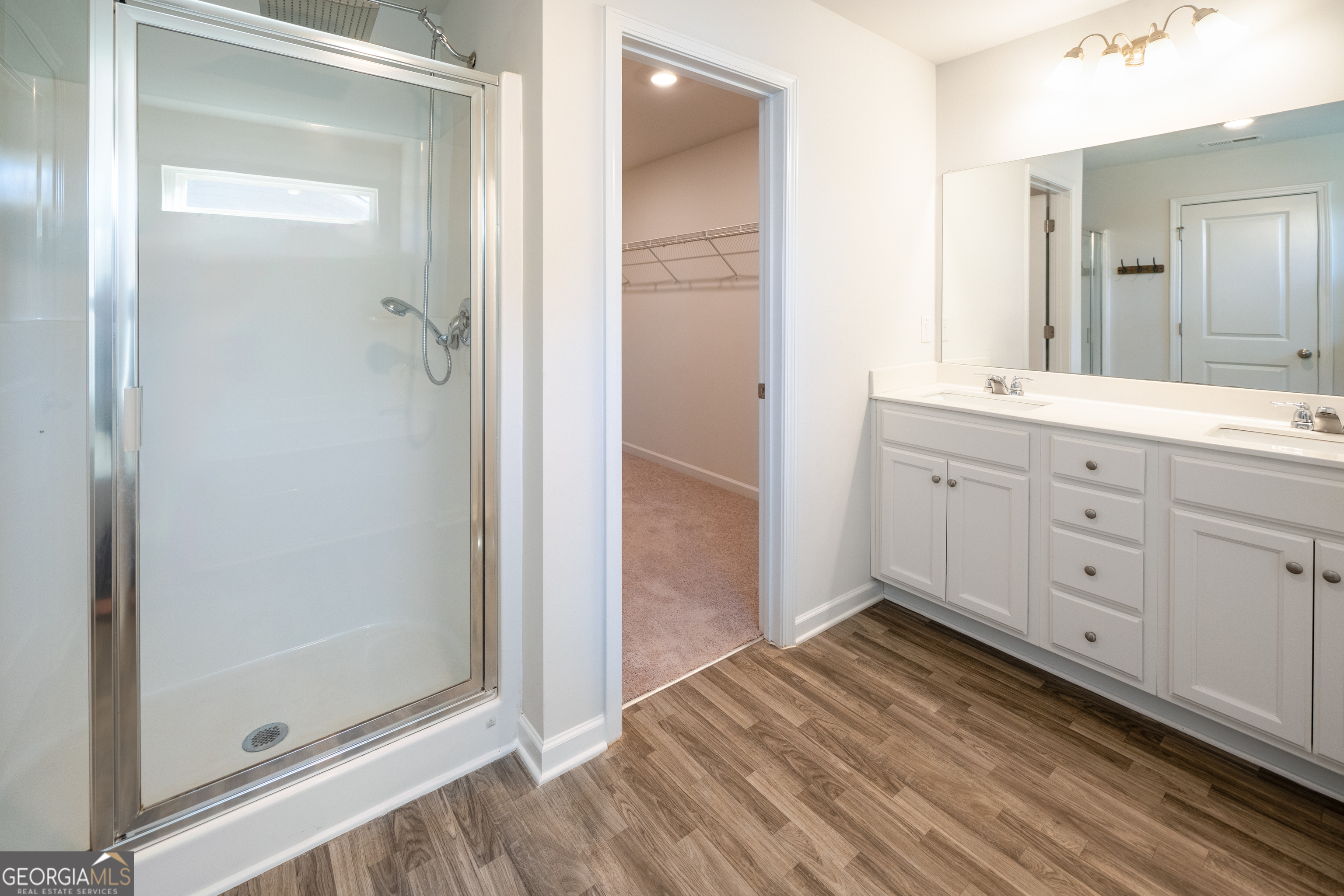 132 Fresh Laurel Lane Locust Grove, GA 30248 - Photo 21 of 24 a bathroom with a sink and a mirror