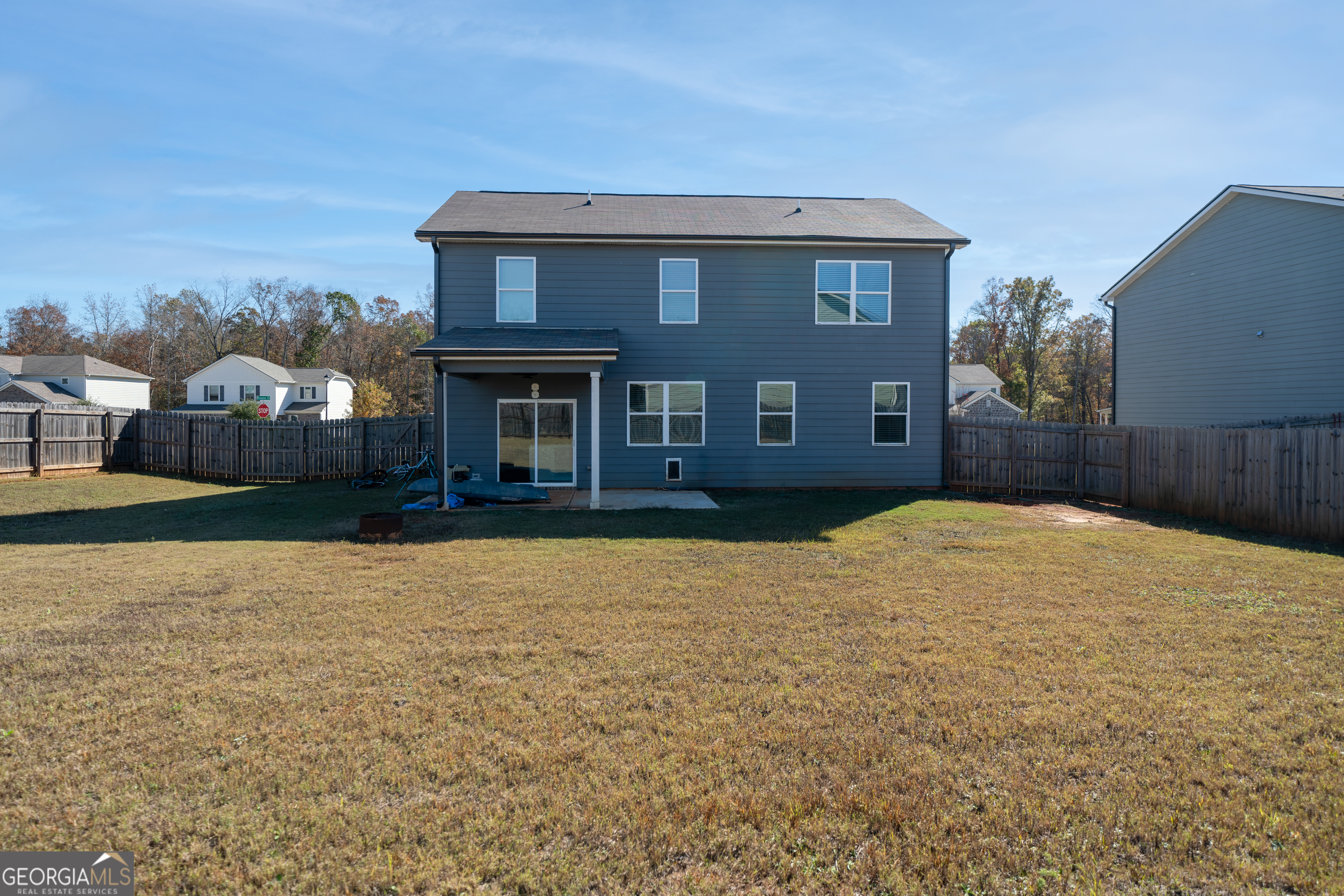 132 Fresh Laurel Lane Locust Grove, GA 30248 - Photo 3 of 24 a house view with a garden space