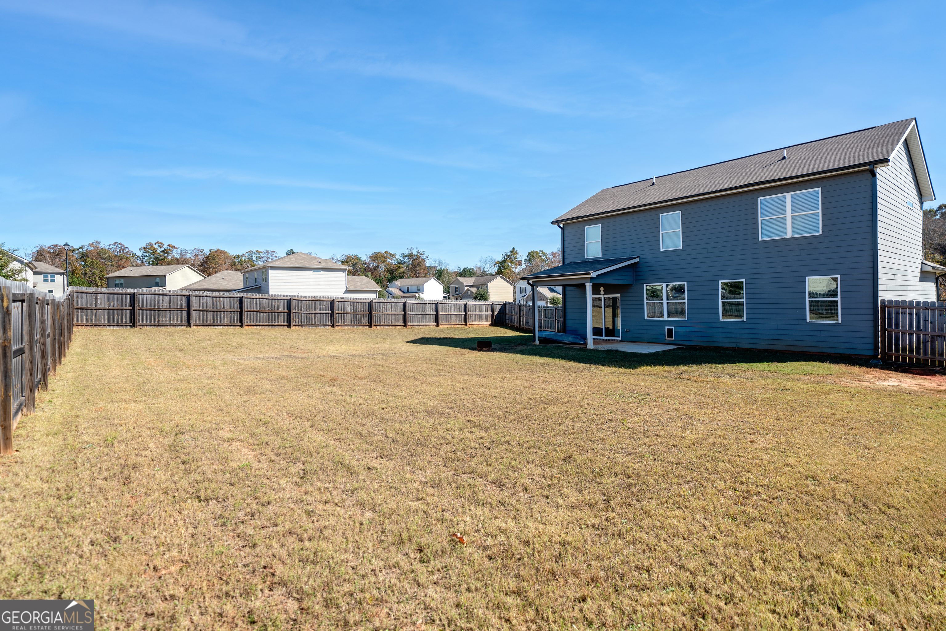 132 Fresh Laurel Lane Locust Grove, GA 30248 - Photo 4 of 24 a house view with a swimming pool