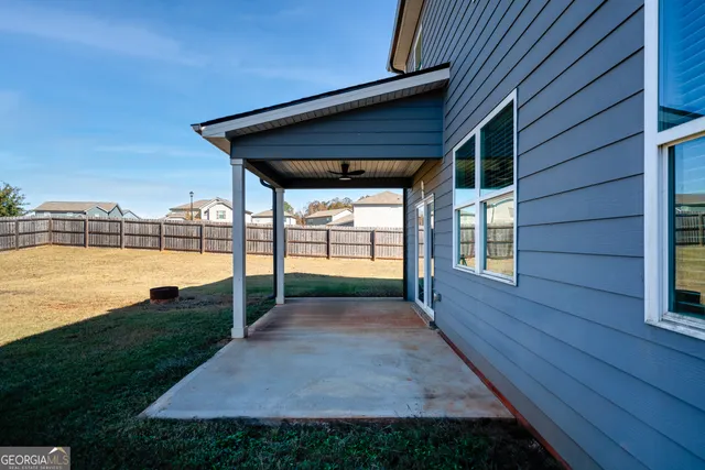 a view of a backyard with wooden floor and outdoor space