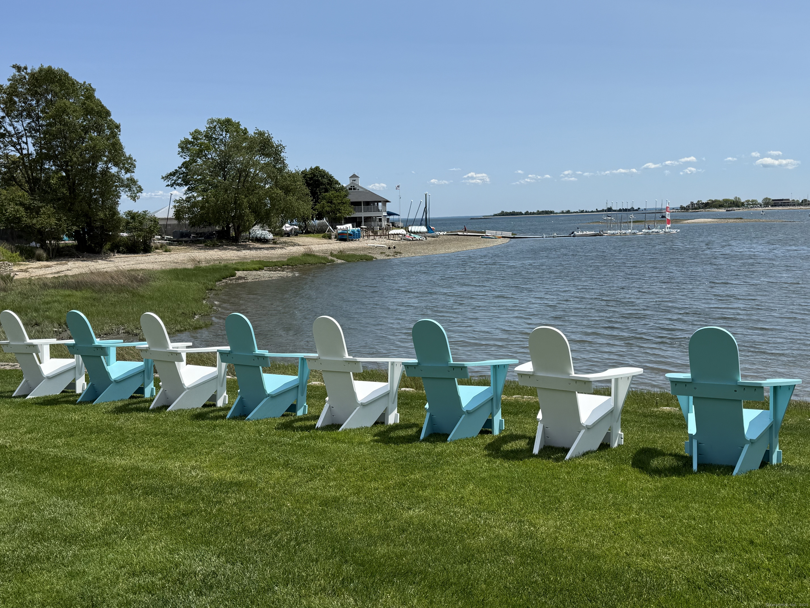 785 Post Road East, Unit 302 Westport, CT 06880 - Photo 34 of 39 a view of a lake with lawn chairs