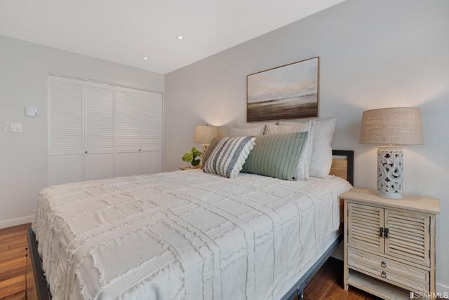 a view of a house with a window and wooden fence