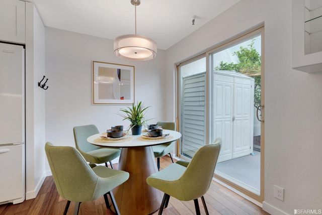 a bedroom with a bed a table and chair