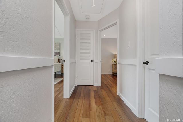 a backyard of a house with barbeque oven table and chairs