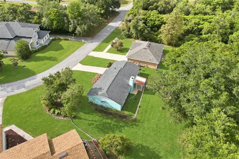 an aerial view of a house with a garden