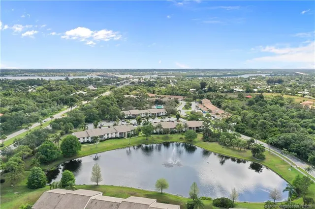an aerial view of a house with a lake view