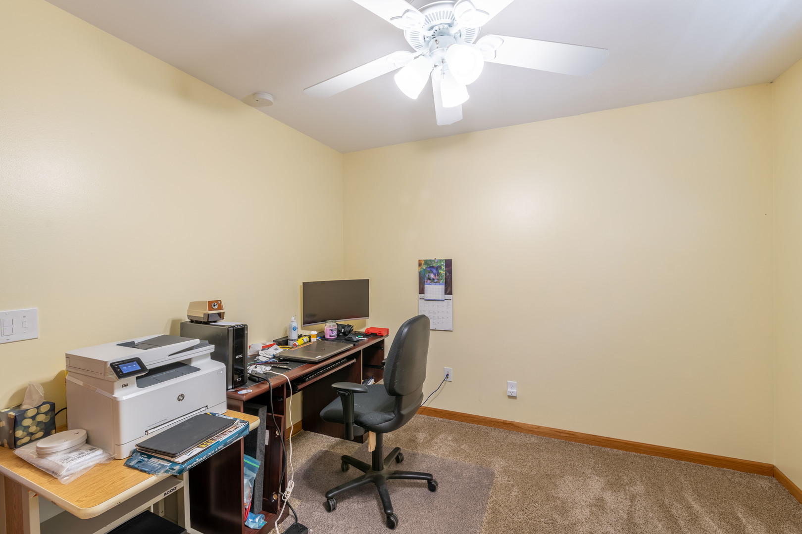 215 Fernwood Road Montgomery, IL 60538 - Photo 6 of 18 a view of a workspace with furniture and a window