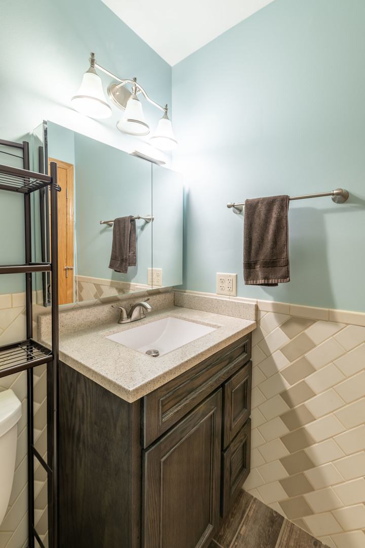215 Fernwood Road Montgomery, IL 60538 - Photo 9 of 18 a bathroom with a sink and a mirror