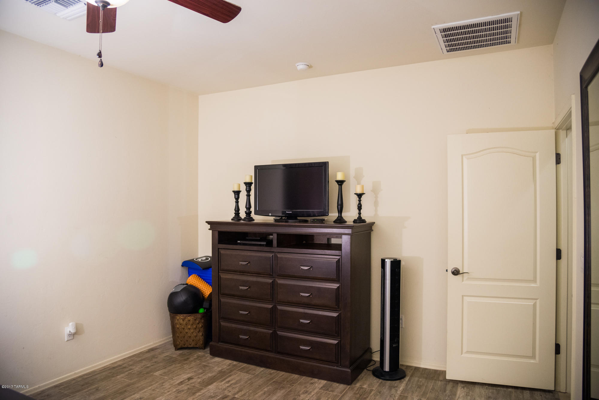 4405 West Crystal Ranch Place Marana, AZ 85658 - Photo 25 of 44 a room with furniture and flat screen tv