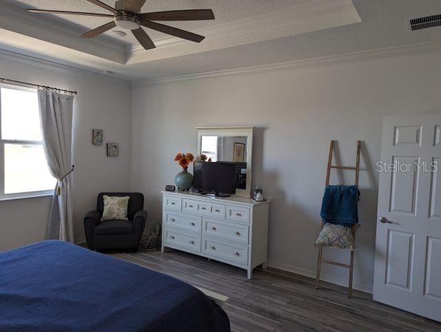 9045 Southwest 78th St Road Ocala, FL 34481 - Photo 11 of 21 a bedroom with a bed and a chair