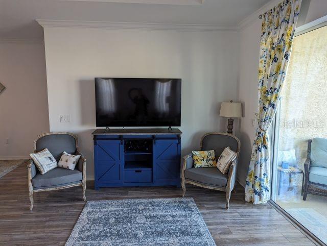 9045 Southwest 78th St Road Ocala, FL 34481 - Photo 5 of 21 a living room with furniture and a flat screen tv