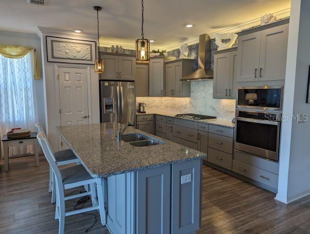 9045 Southwest 78th St Road Ocala, FL 34481 - Photo 9 of 21 a kitchen with kitchen island a counter space a sink appliances and cabinets