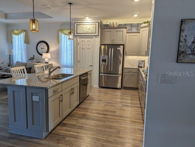 9045 Southwest 78th St Road Ocala, FL 34481 - Photo 10 of 21 a kitchen with stainless steel appliances granite countertop a sink and a refrigerator