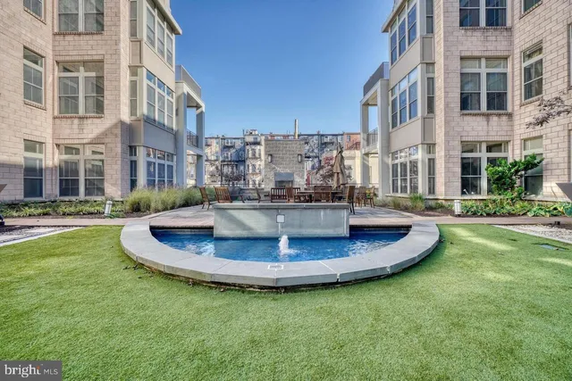 a swimming pool with barbeque oven