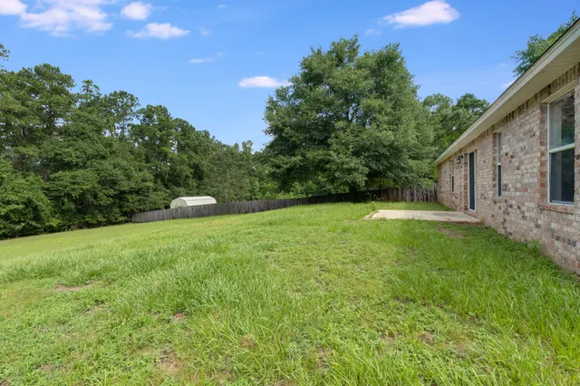 a view of hallway with wooden floor