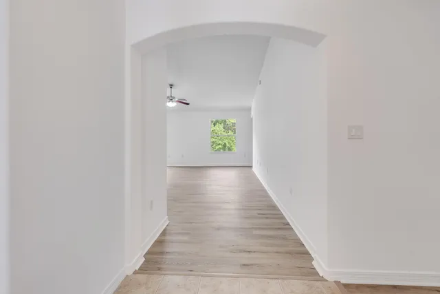 a view of an empty room with a window