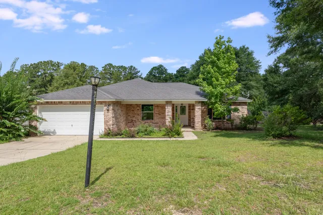 a view of a field and basketball court