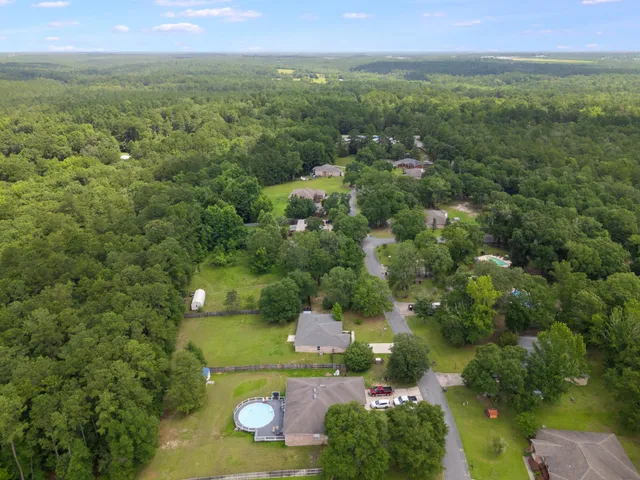 a view of a field with an ocean