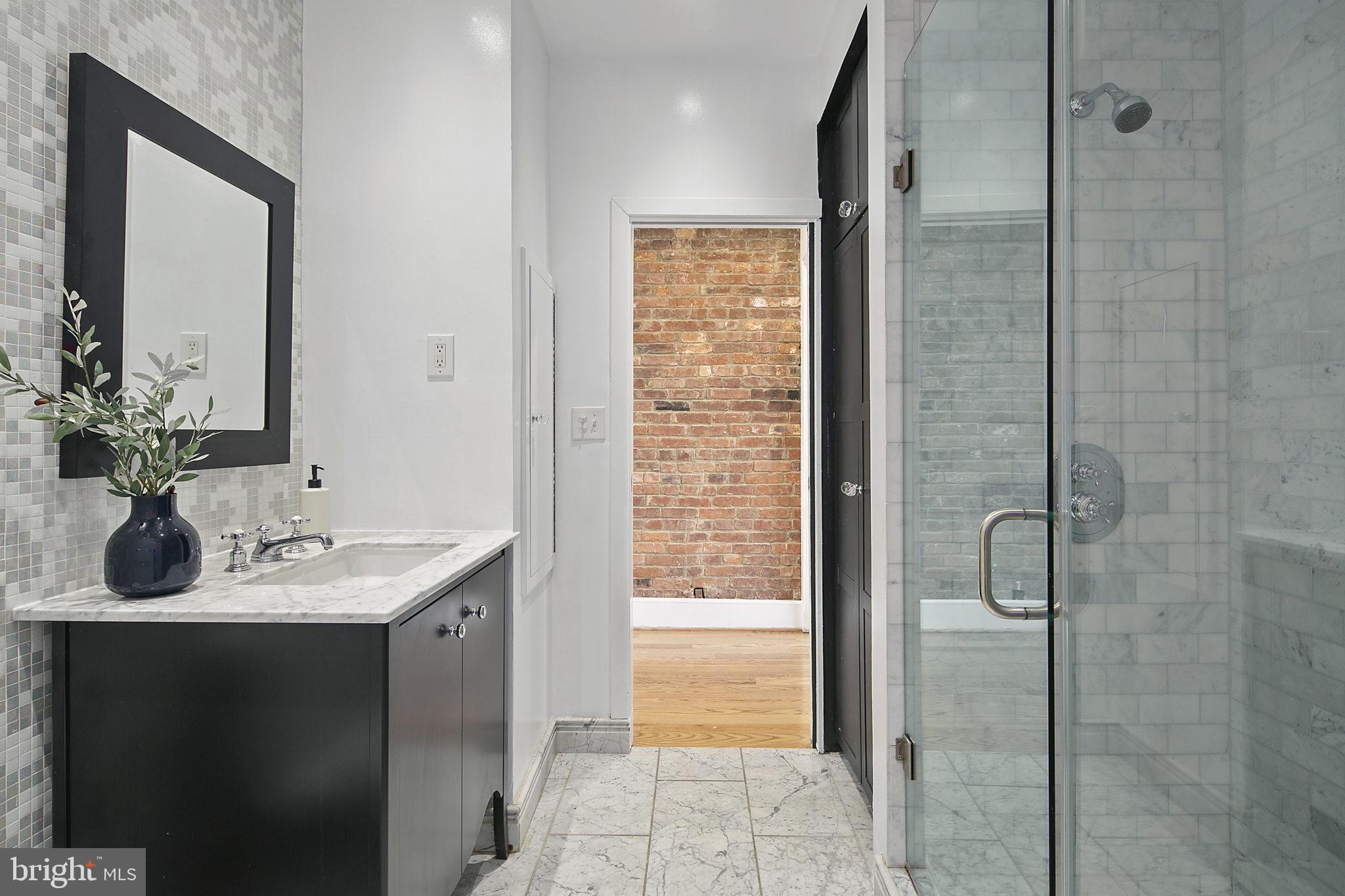 715 10th Street Northeast Washington, DC 20002 - Photo 28 of 49 Full bathroom w/ marble tile and new washer dryer