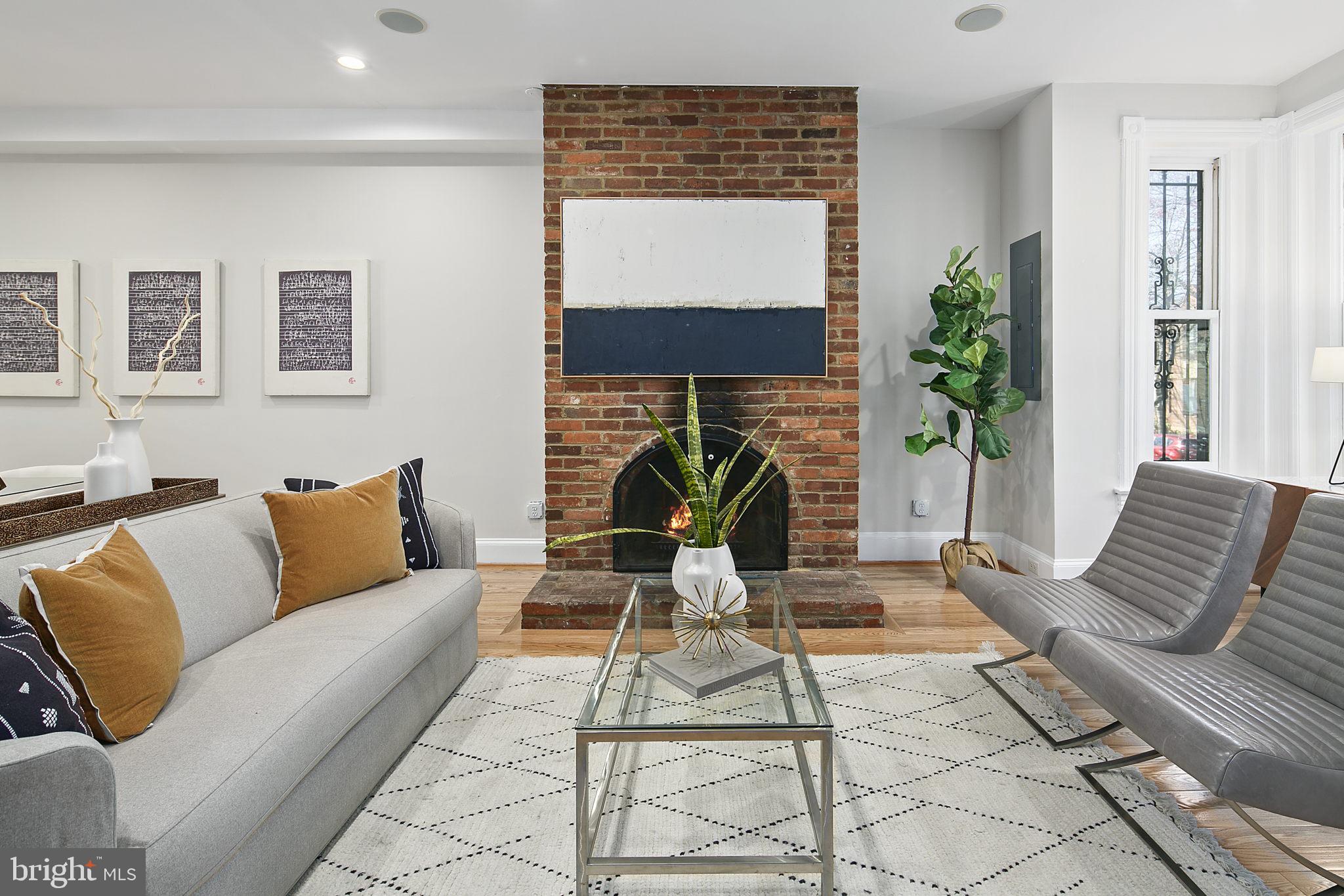 715 10th Street Northeast Washington, DC 20002 - Photo 6 of 49 Brick fireplace in the large living room