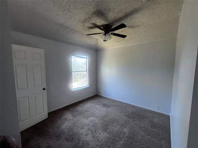 a view of empty room with windows