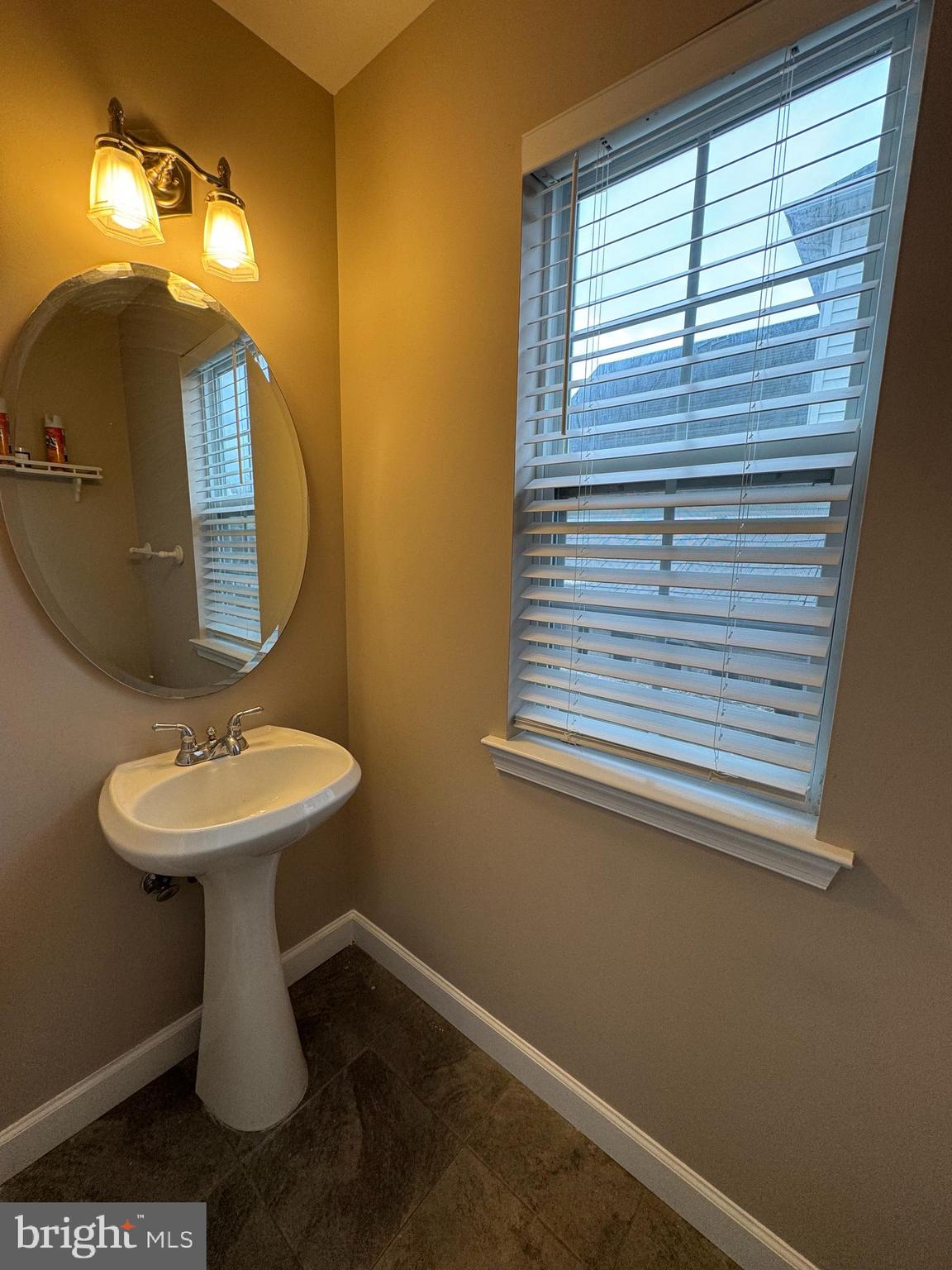 27 Yorkshire Village Road Lawrenceville, NJ 08648 - Photo 11 of 32 a bathroom with a sink a mirror and a toilet