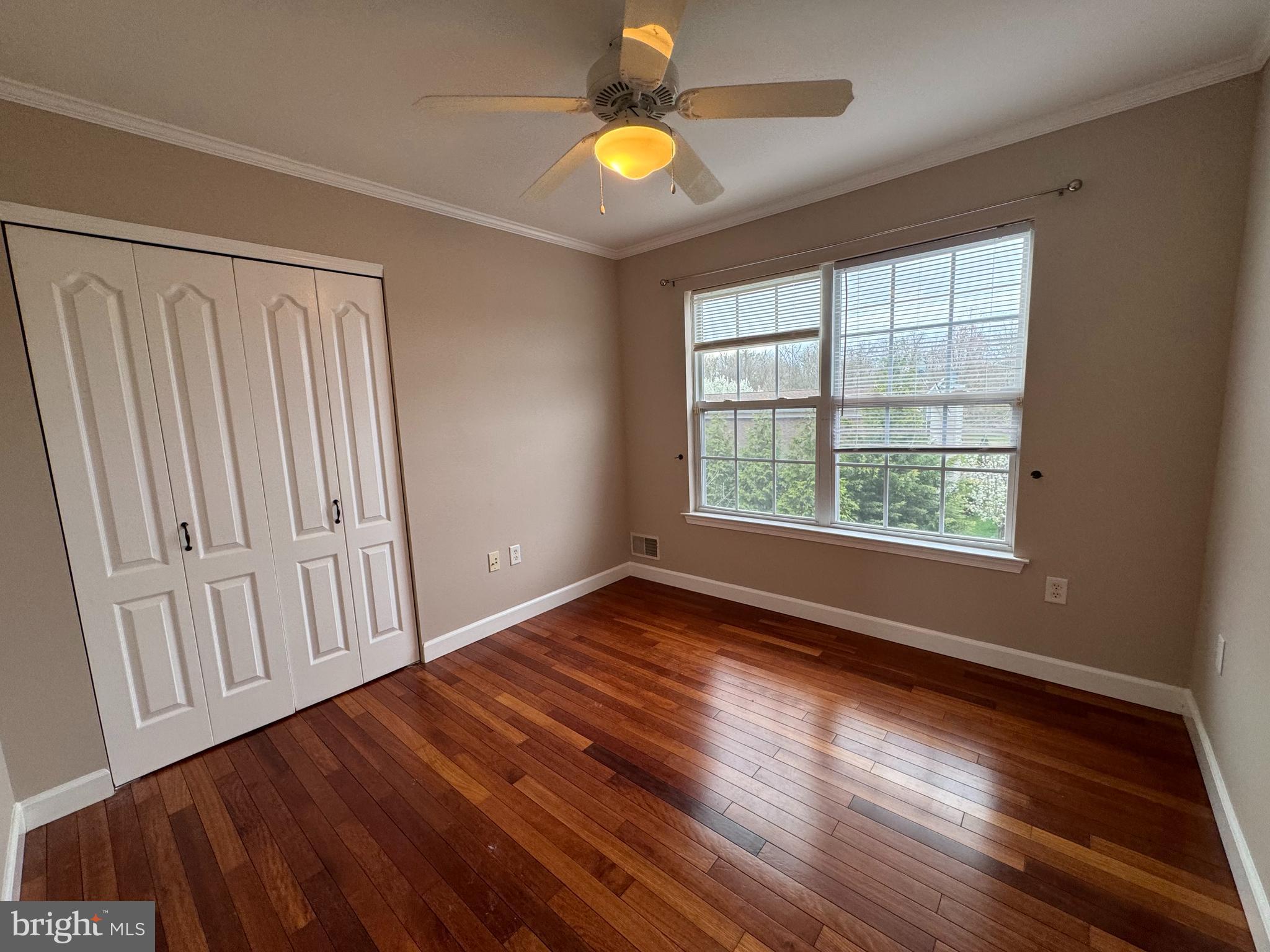 27 Yorkshire Village Road Lawrenceville, NJ 08648 - Photo 15 of 32 wooden floor in an empty room with a window
