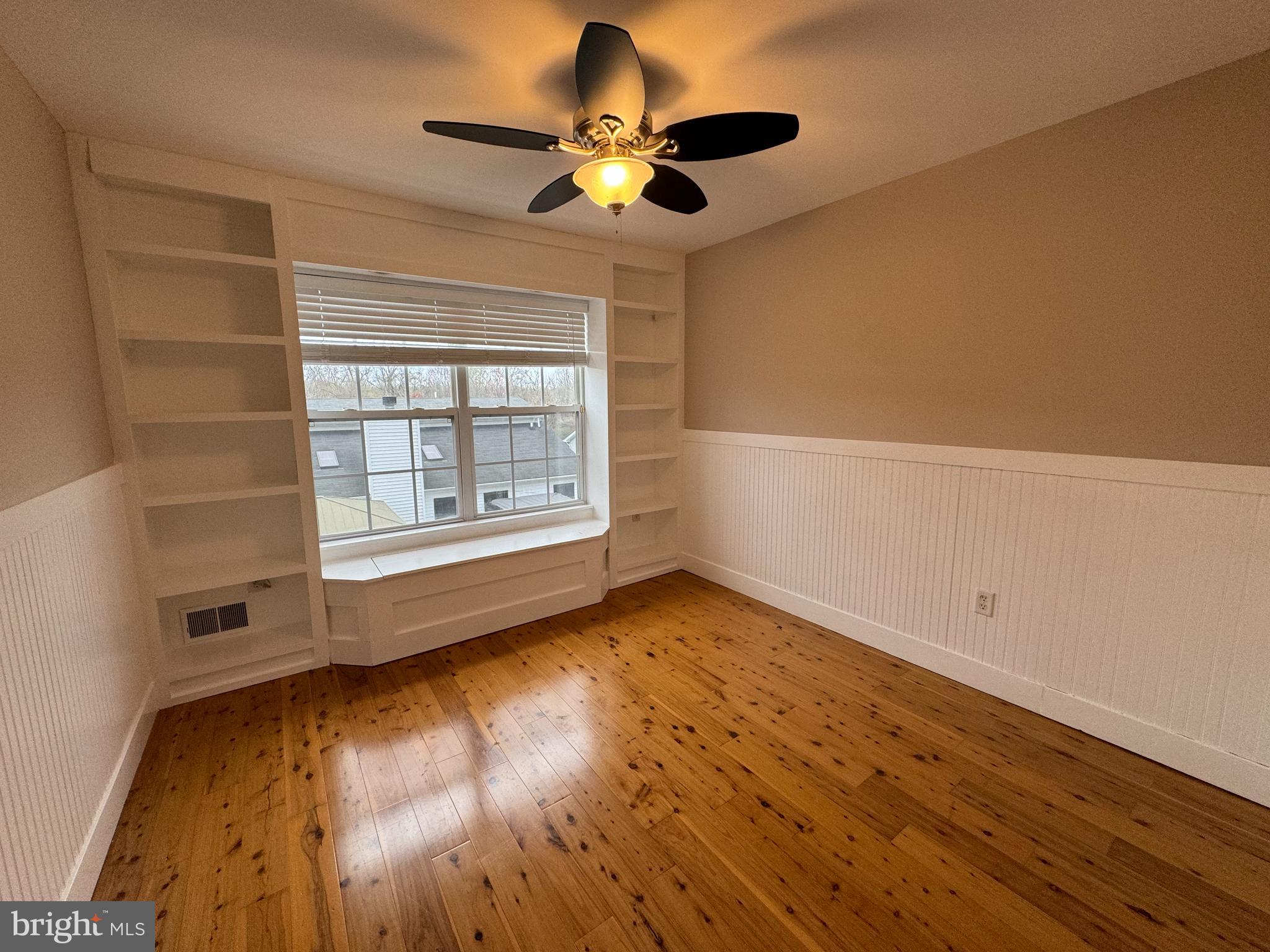 27 Yorkshire Village Road Lawrenceville, NJ 08648 - Photo 16 of 32 an empty room with wooden floor and windows