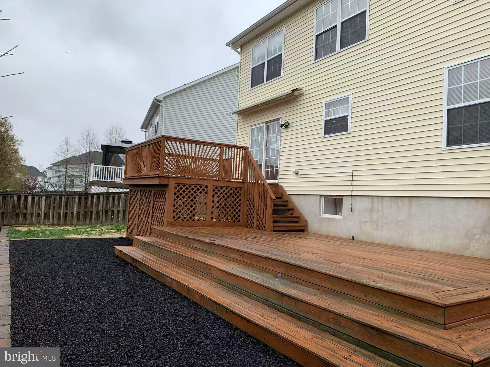 27 Yorkshire Village Road Lawrenceville, NJ 08648 - Photo 31 of 32 a view of a house with a wooden deck