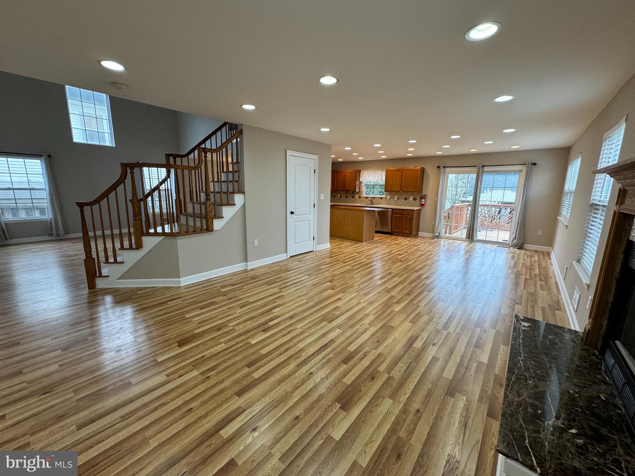 27 Yorkshire Village Road Lawrenceville, NJ 08648 - Photo 5 of 32 a view of a living room a dining room with wooden floor and a window