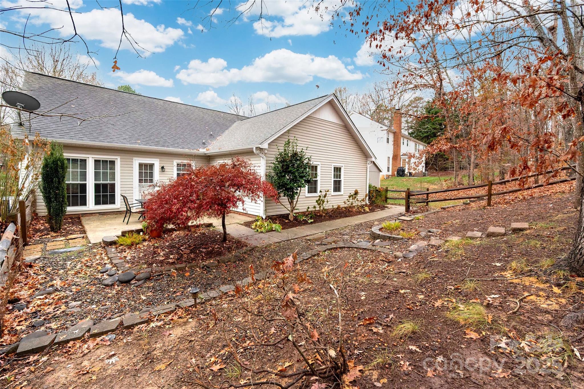 6045 Burnt Mill Run Matthews, NC 28104 - Photo 27 of 32 a view of a house with a yard