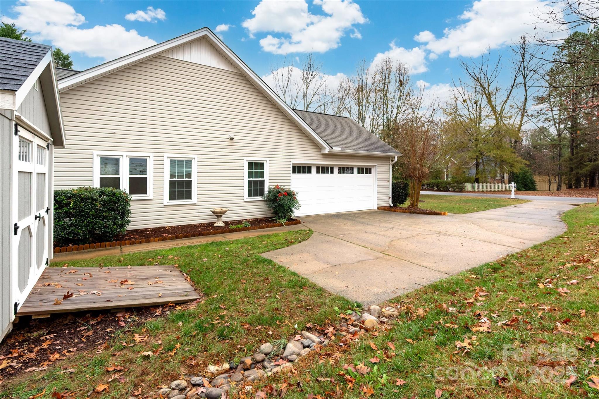 6045 Burnt Mill Run Matthews, NC 28104 - Photo 30 of 32 a view of a house with backyard and sitting area