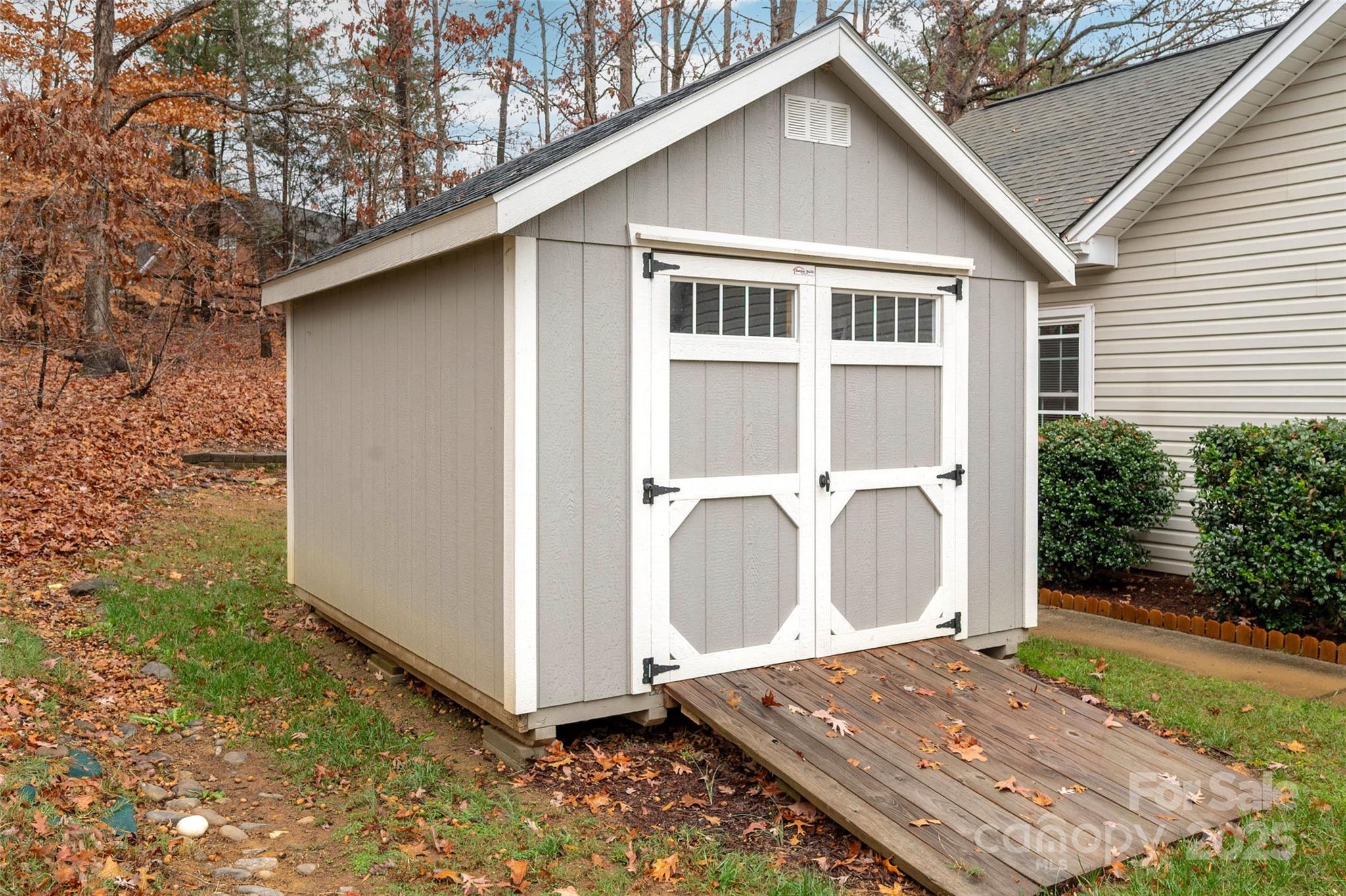6045 Burnt Mill Run Matthews, NC 28104 - Photo 31 of 32 a view of a house with a yard