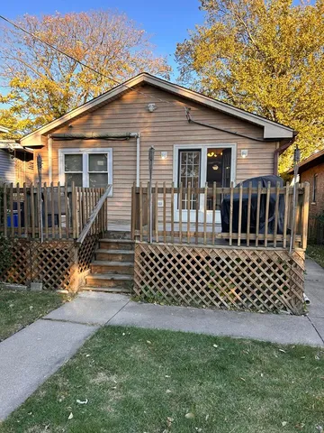 a backyard of a house with wooden fence