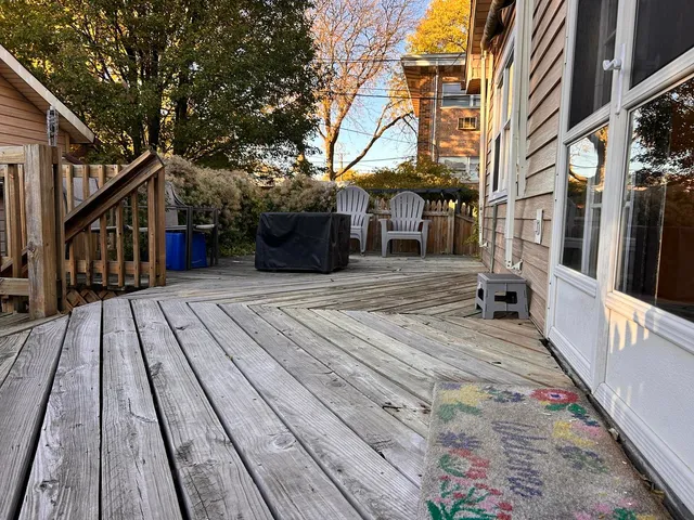 a backyard of a house with yard and outdoor seating