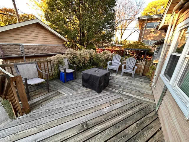 a view of a house with a flower garden