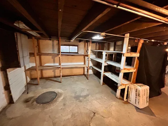 a view of an empty room with windows