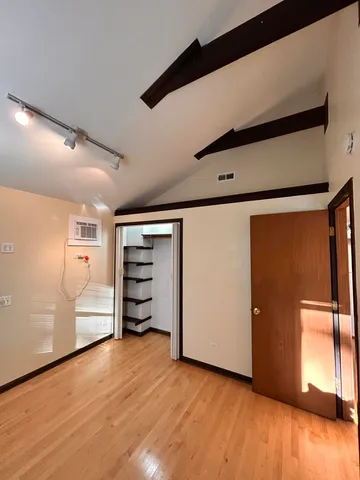 a view of a big room with wooden floors