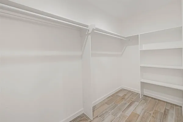 a view of an empty walk in closet