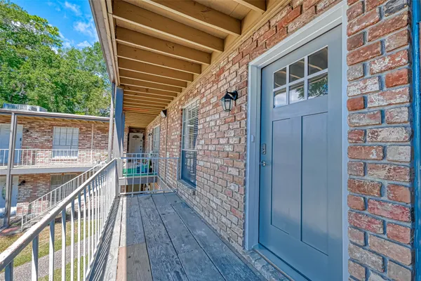 a view of balcony with wooden floor