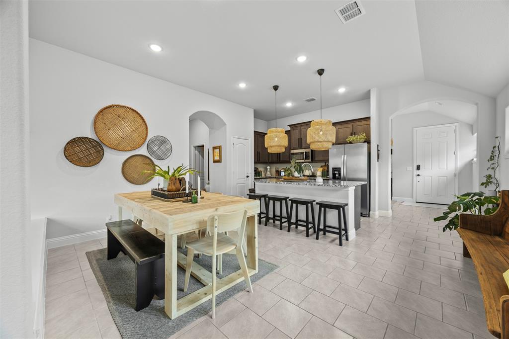 1084 Imperial Eagle Road Alvarado, TX 76009 - Photo 17 of 39 a view of kitchen with kitchen island stainless steel appliances a dining table and chairs